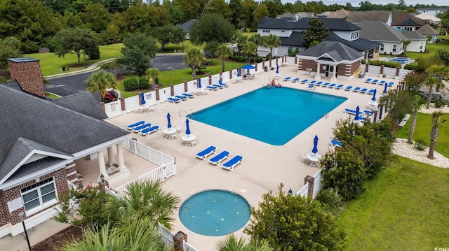 1315 Ashboro Ct, Myrtle Beach, SC 29579 - community pool featuring a patio, fence, and a lawn