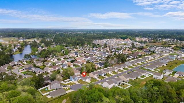 drone / aerial view featuring a residential view and a water view