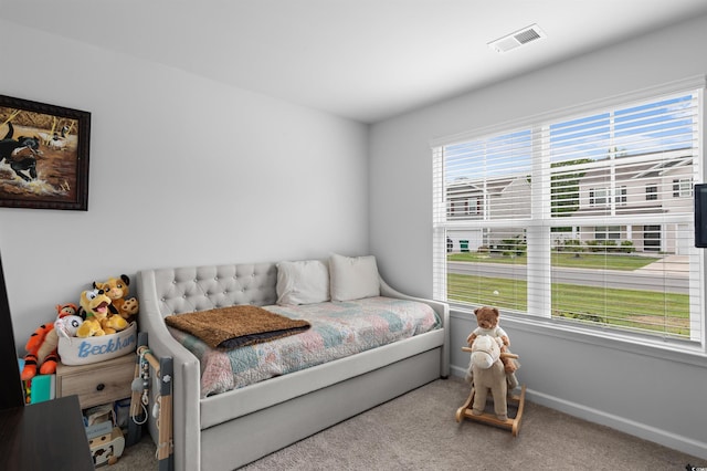 bedroom featuring visible vents, carpet, and baseboards