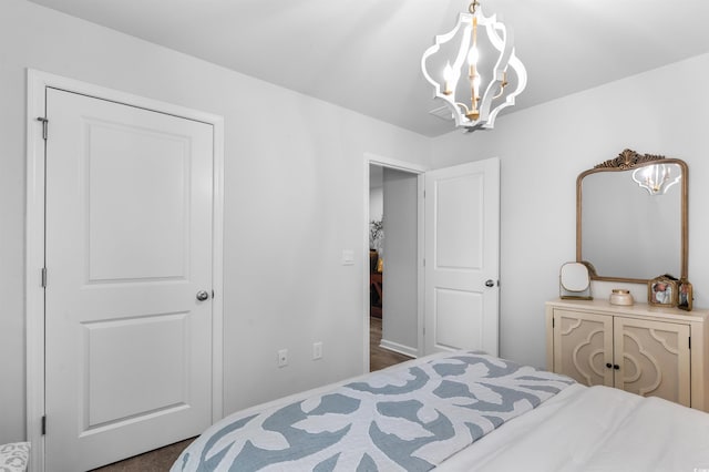 bedroom with a notable chandelier