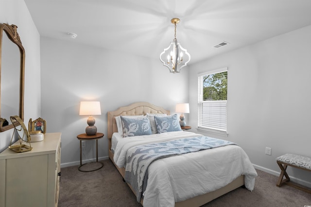 carpeted bedroom with an inviting chandelier, baseboards, and visible vents