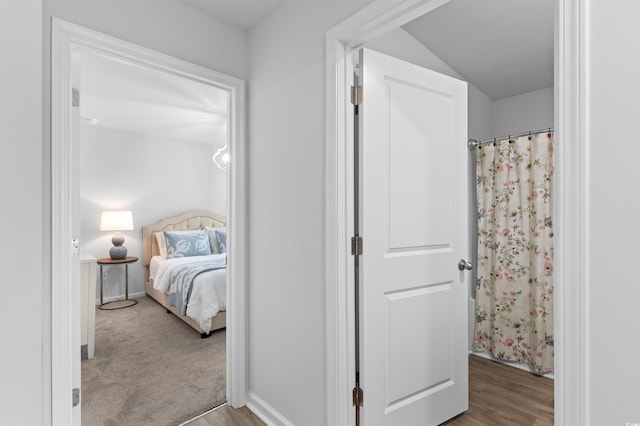 bedroom featuring baseboards and wood finished floors