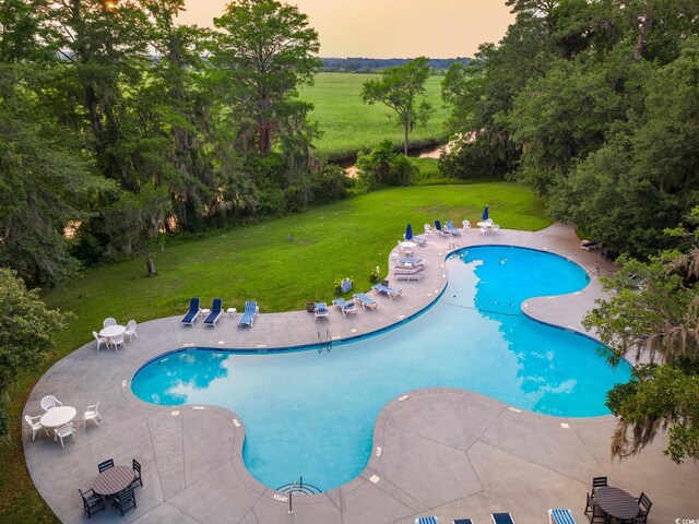 35 Red Skiff Ln Unit 35, Pawleys Island, SC 29585 - community pool with a patio area and a yard