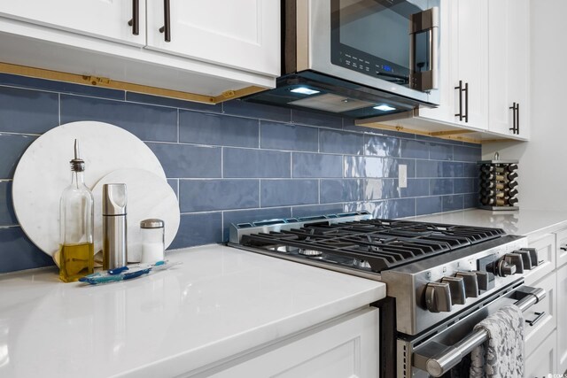 35 Red Skiff Ln Unit 35, Pawleys Island, SC 29585 - kitchen view of appliances with stainless steel finishes, white cabinetry, light countertops, and backsplash