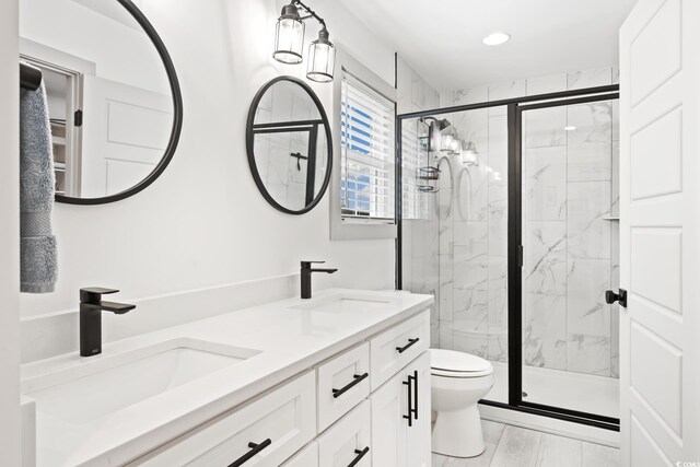 35 Red Skiff Ln Unit 35, Pawleys Island, SC 29585 - bathroom featuring toilet, a marble finish shower, double vanity, and recessed lighting