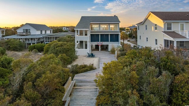 35 Red Skiff Ln Unit 35, Pawleys Island, SC 29585 - back of house at dusk with a sunroom