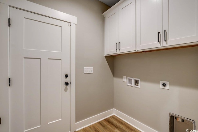 204 Shady Pines Ct, Conway, SC 29527 - laundry area with cabinet space, baseboards, hookup for a washing machine, light wood-style flooring, and hookup for an electric dryer