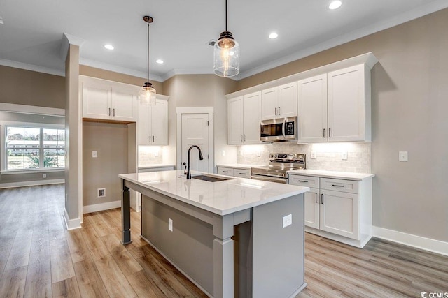 204 Shady Pines Ct, Conway, SC 29527 - kitchen featuring stainless steel appliances, a sink, white cabinets, ornamental molding, and decorative backsplash