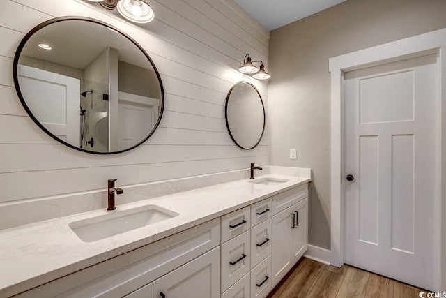 204 Shady Pines Ct, Conway, SC 29527 - full bathroom featuring double vanity, wood finished floors, a tile shower, and wooden walls