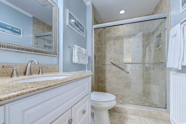 full bath featuring vanity, tile patterned flooring, ornamental molding, toilet, and a stall shower