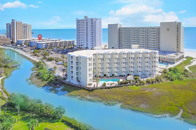 bird's eye view featuring a water view and a city view
