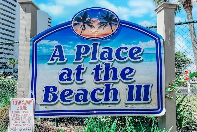 community sign with fence