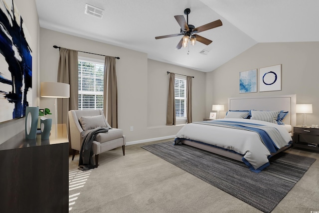 bedroom featuring lofted ceiling, carpet flooring, multiple windows, and visible vents