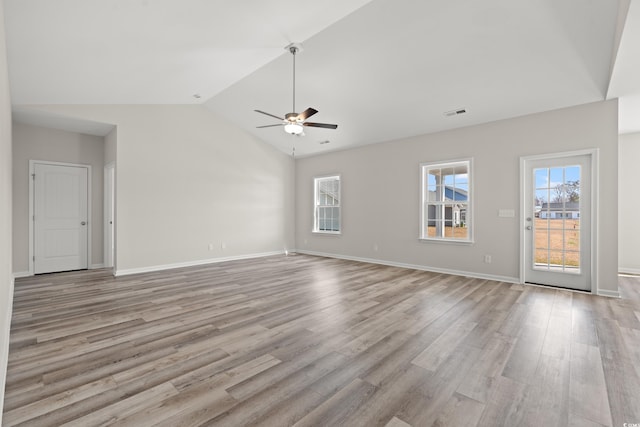 1513 Anne St, North Myrtle Beach, SC 29582 - unfurnished living room with plenty of natural light, a ceiling fan, light wood-style flooring, and vaulted ceiling