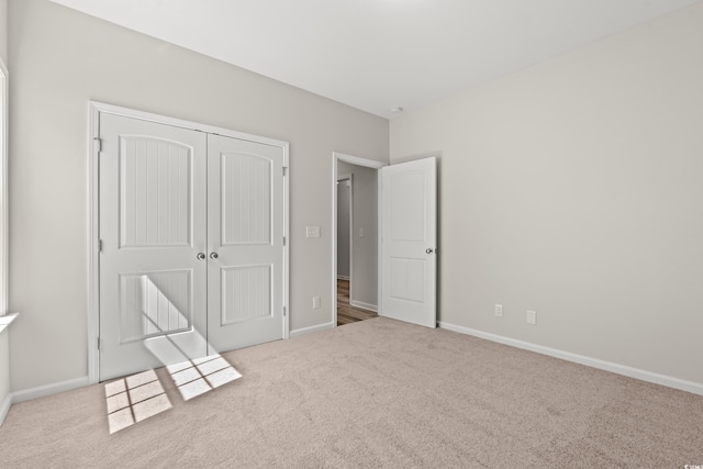 1513 Anne St, North Myrtle Beach, SC 29582 - unfurnished bedroom featuring carpet flooring and a closet
