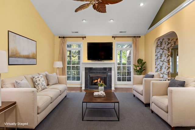 808 E Coast Ln, North Myrtle Beach, SC 29582 - living room with lofted ceiling, ceiling fan, arched walkways, a high end fireplace, and recessed lighting