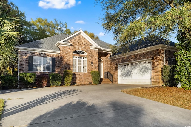 808 E Coast Ln, North Myrtle Beach, SC 29582 - view of front of property with driveway, brick siding, an attached garage, and roof with shingles