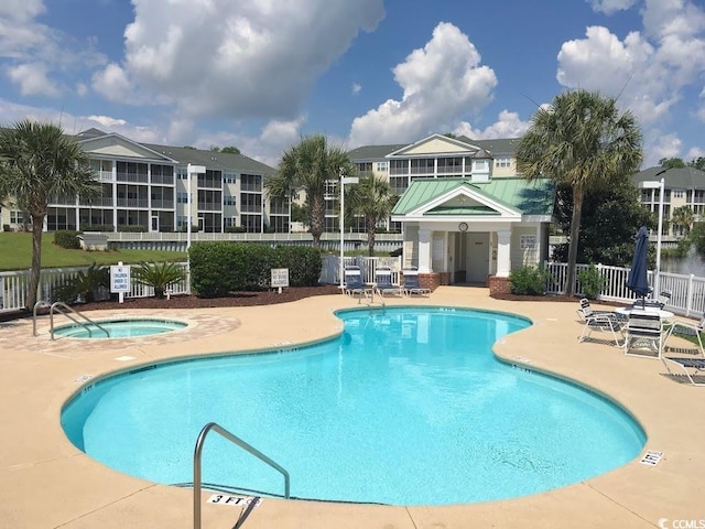 808 E Coast Ln, North Myrtle Beach, SC 29582 - community pool with a community hot tub and a patio