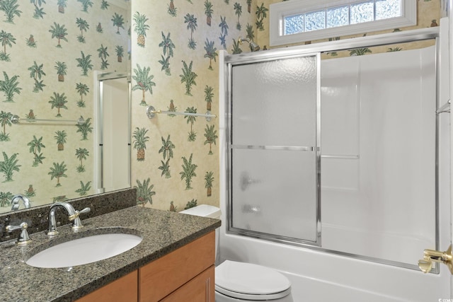 808 E Coast Ln, North Myrtle Beach, SC 29582 - bathroom with wallpapered walls, vanity, and combined bath / shower with glass door