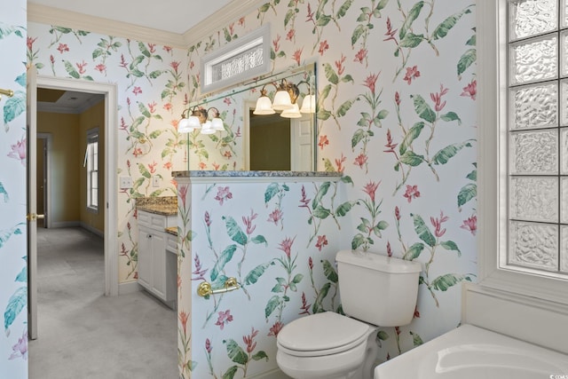 808 E Coast Ln, North Myrtle Beach, SC 29582 - bathroom with wallpapered walls, ornamental molding, vanity, healthy amount of natural light, and a bath