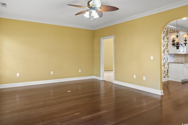 808 E Coast Ln, North Myrtle Beach, SC 29582 - spare room with ceiling fan, ornamental molding, arched walkways, and dark wood finished floors