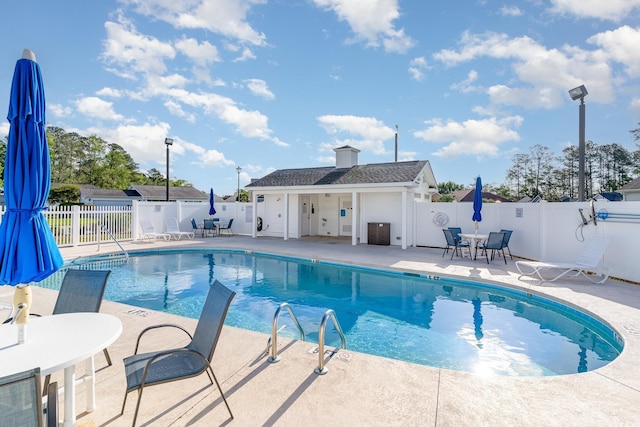180 Oak Crest Cir, Longs, SC 29568 - community pool with a patio and outdoor dining area