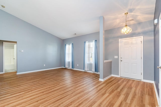 180 Oak Crest Cir, Longs, SC 29568 - foyer featuring light wood finished floors, a chandelier, baseboards, and high vaulted ceiling