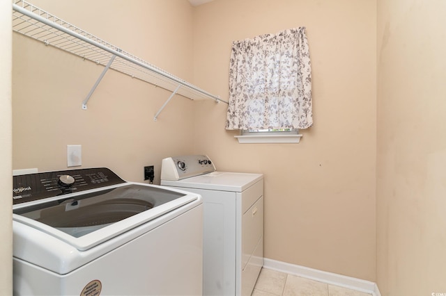 180 Oak Crest Cir, Longs, SC 29568 - laundry room with washing machine and dryer, light tile patterned floors, and baseboards
