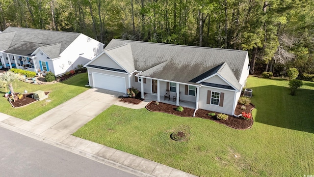 180 Oak Crest Cir, Longs, SC 29568 - view of front of property with a garage, a front yard, driveway, and covered porch