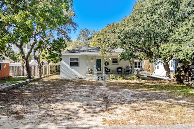 back of house featuring fence