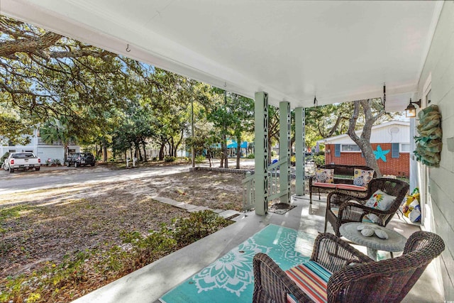 view of patio featuring a porch