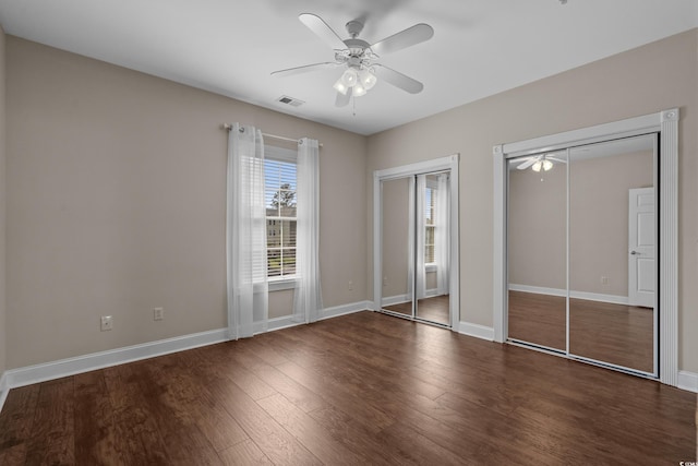 4891 Luster Leaf Cir Unit 301, Myrtle Beach, SC 29577 - unfurnished bedroom with multiple closets, wood finished floors, and ceiling fan