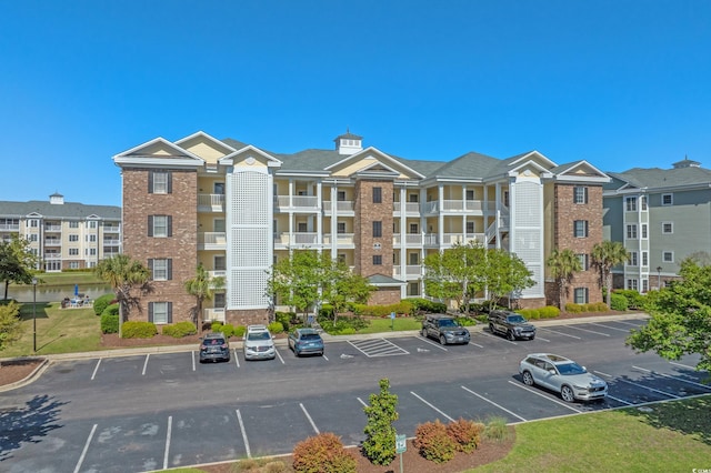 4891 Luster Leaf Cir Unit 301, Myrtle Beach, SC 29577 - view of apartment building / complex featuring uncovered parking