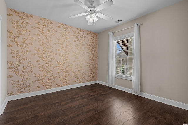 4891 Luster Leaf Cir Unit 301, Myrtle Beach, SC 29577 - empty room featuring dark wood-style flooring, ceiling fan, and wallpapered walls