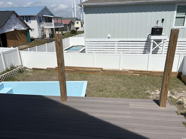 deck featuring a residential view and a fenced backyard