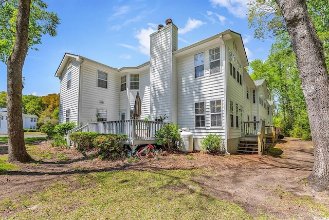 157 Egret Run Ln Unit 514, Pawleys Island, SC 29585 - back of property with a wooden deck and a chimney