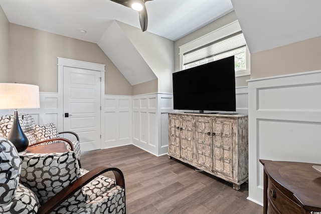 1006 Surf Pointe Dr, North Myrtle Beach, SC 29582 - sitting room featuring a decorative wall, wood finished floors, a wainscoted wall, a ceiling fan, and lofted ceiling
