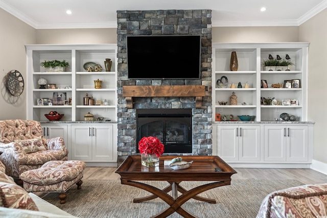 1006 Surf Pointe Dr, North Myrtle Beach, SC 29582 - living area featuring light wood-style floors, crown molding, a stone fireplace, and recessed lighting