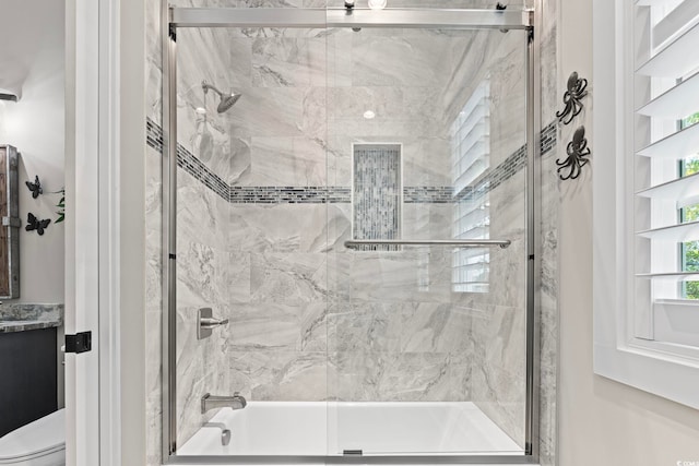 1006 Surf Pointe Dr, North Myrtle Beach, SC 29582 - bathroom featuring toilet and shower / bath combination with glass door