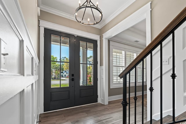 1006 Surf Pointe Dr, North Myrtle Beach, SC 29582 - entrance foyer with french doors, a chandelier, crown molding, and wood finished floors