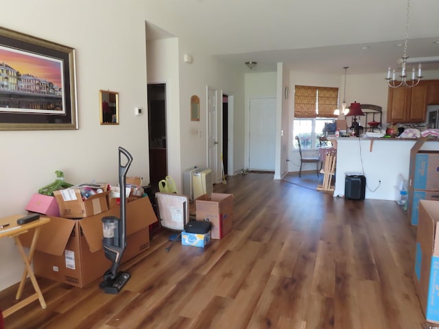 living room featuring a chandelier and wood finished floors