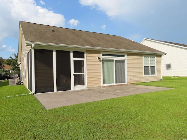 819 Brookline Dr, Myrtle Beach, SC 29579 - rear view of house featuring a patio area, a lawn, and roof with shingles