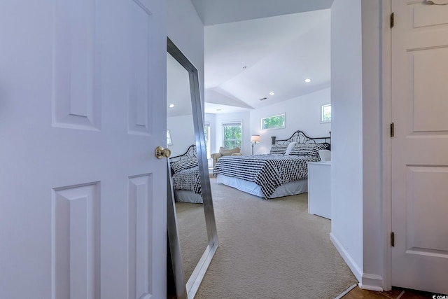 bedroom with recessed lighting, carpet, and vaulted ceiling