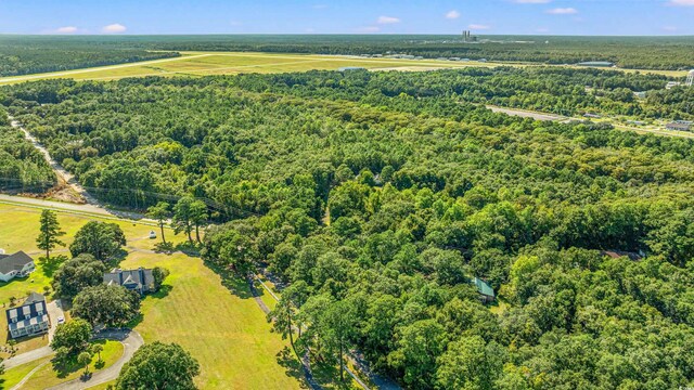 aerial view with a wooded view