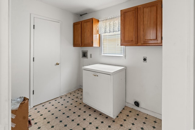 laundry room with cabinet space, washer hookup, light floors, and hookup for an electric dryer