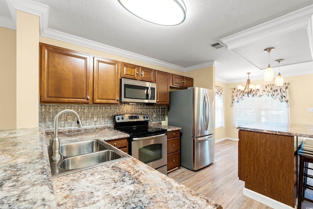 820 Fairway Dr Unit 1506Hh, Longs, SC 29568 - kitchen with stainless steel appliances, a sink, brown cabinetry, crown molding, and light wood-style flooring