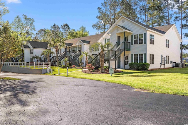 820 Fairway Dr Unit 1506Hh, Longs, SC 29568 - view of front facade featuring stairs, a front lawn, and cooling unit