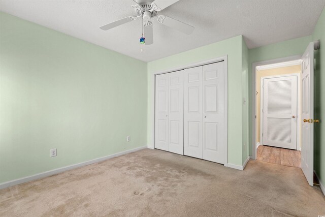 820 Fairway Dr Unit 1506Hh, Longs, SC 29568 - unfurnished bedroom featuring carpet floors, baseboards, a closet, ceiling fan, and a textured ceiling