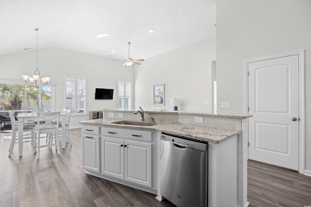 kitchen with stainless steel dishwasher, a sink, a ceiling fan, dark wood finished floors, and hanging light fixtures