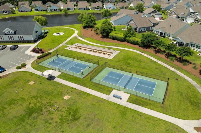 aerial view of residential area with a large body of water